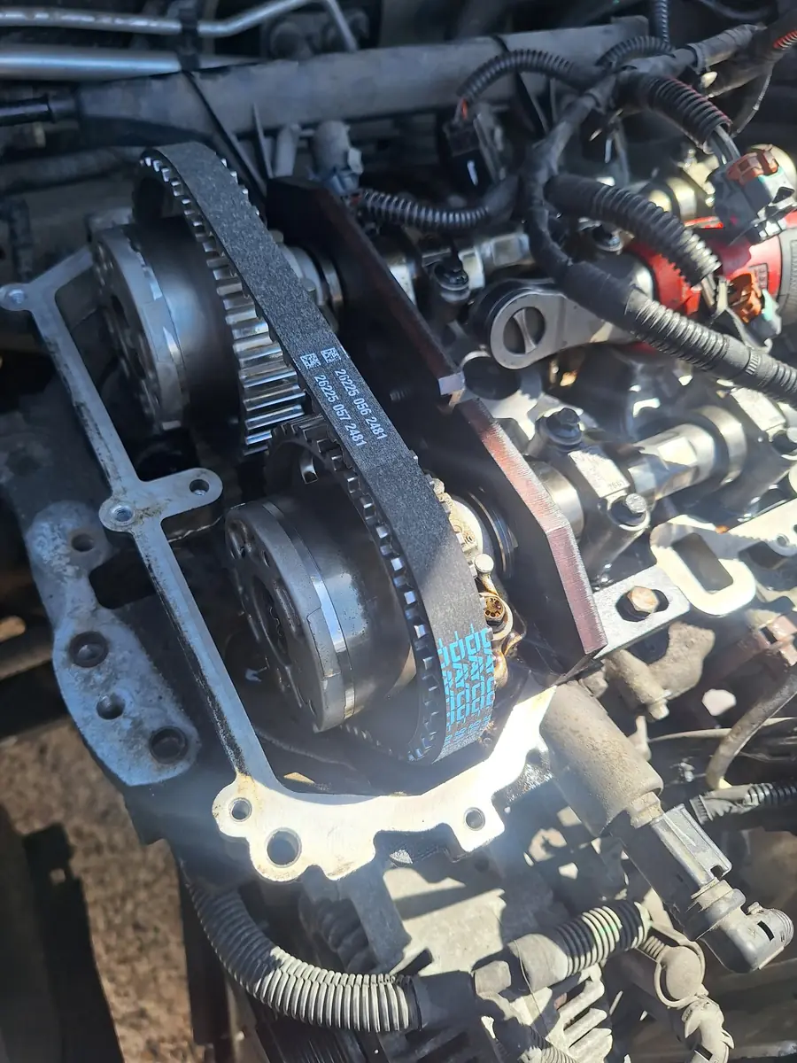 A new timing belt fitted around the camshaft sprockets